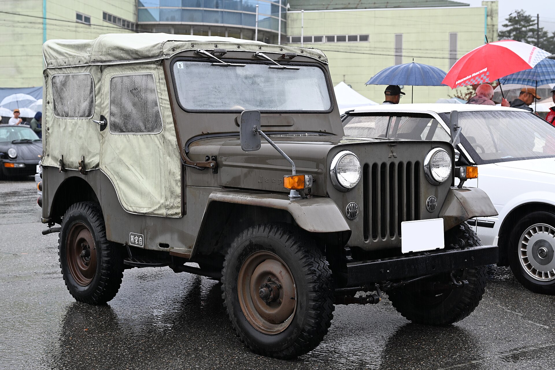 An olive Mitsubishi Jeep J54 built in Japan under license